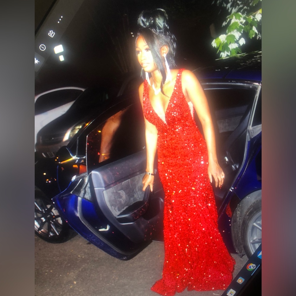 Beautiful red sequin mermaid gown with nude mesh sewn inserts.